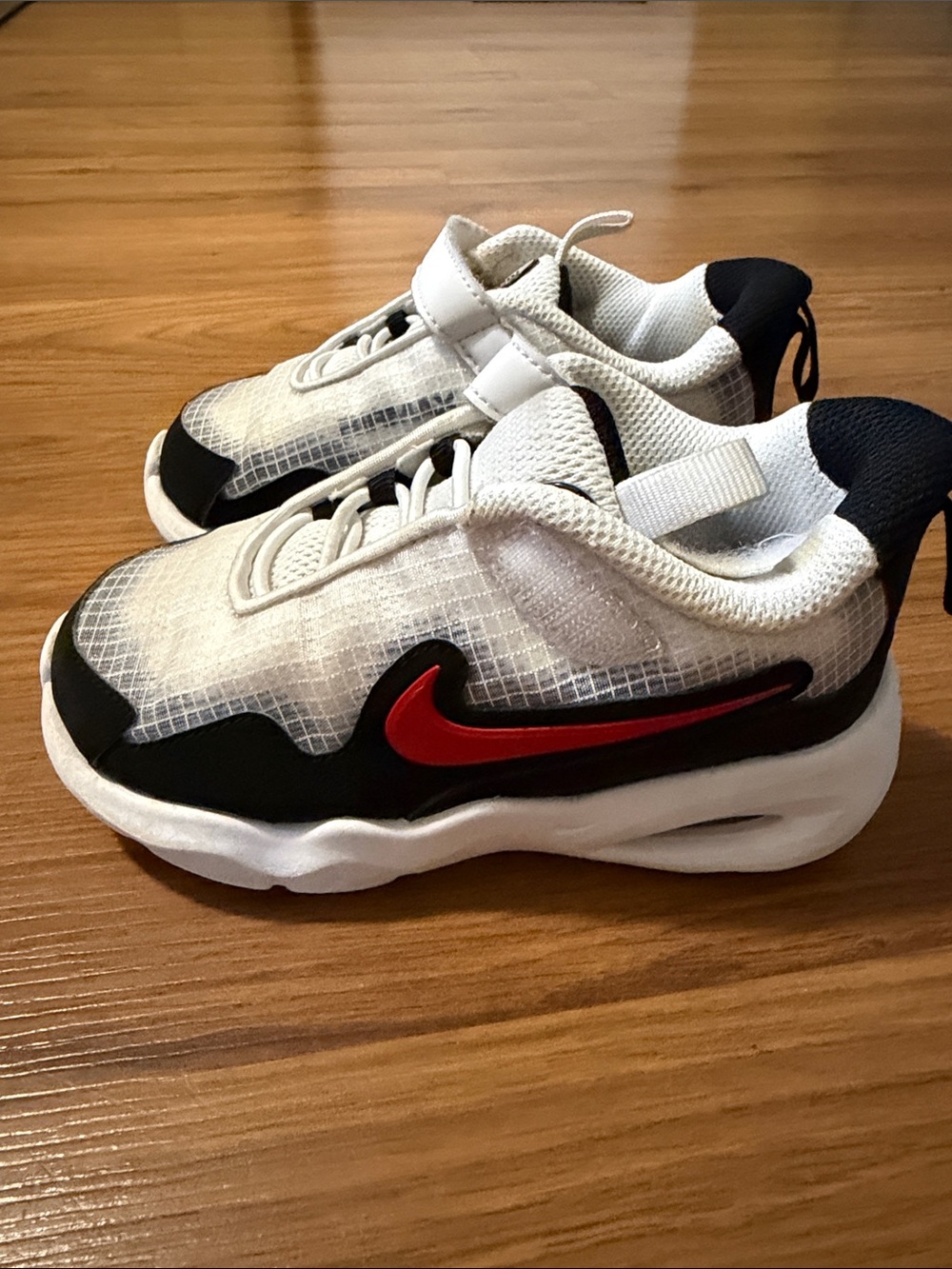 Nike Kids White and Black Sneakers with Red Swoosh